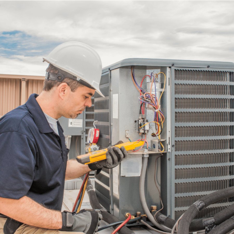Lakeshore Heating & Cooling HVAC technician servicing a system