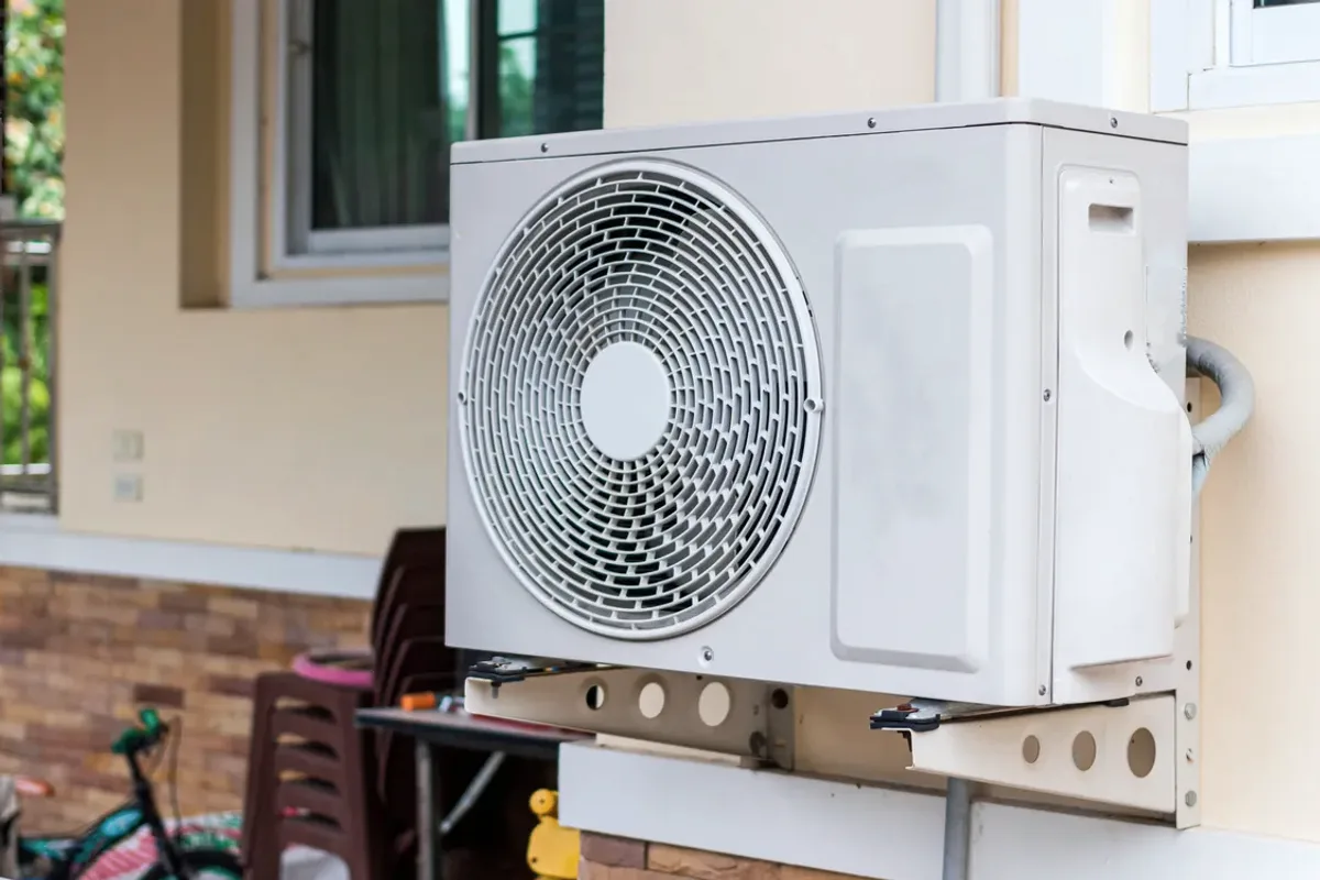 Outdoor heat pump unit on a wall bracket